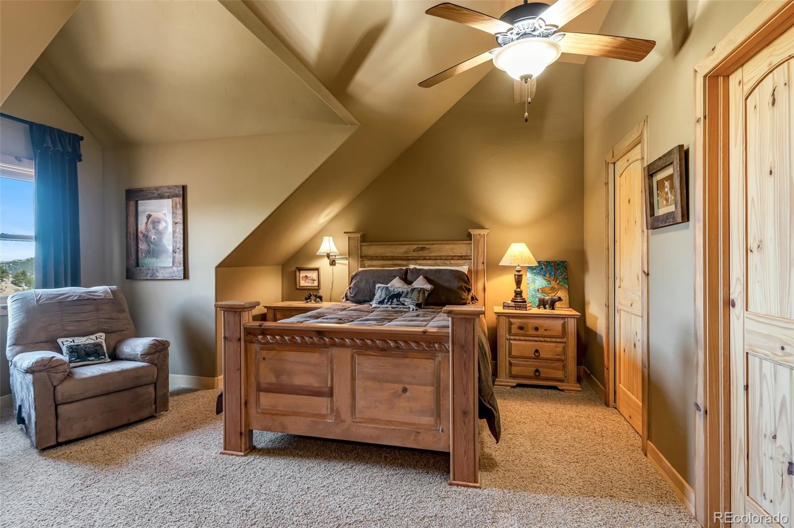 400 Ridge Road Westcliffe, CO 81252 - Photo 22 of 37 a bed room with a bed and a couch
