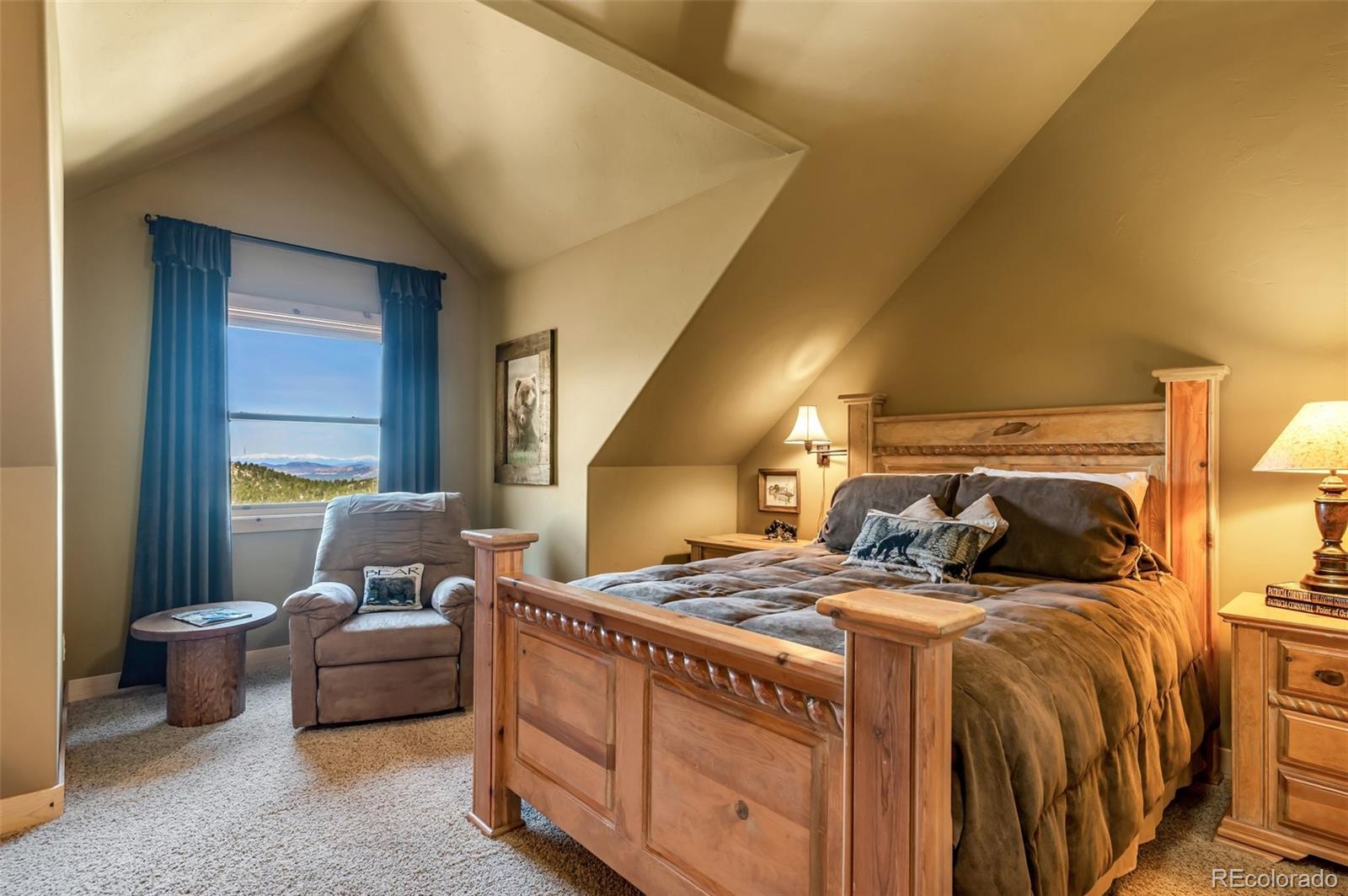 400 Ridge Road Westcliffe, CO 81252 - Photo 23 of 37 a bedroom with a bed and a couch
