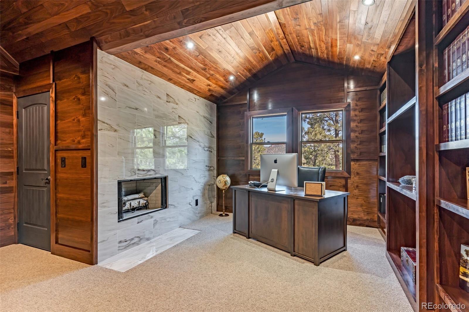 400 Ridge Road Westcliffe, CO 81252 - Photo 26 of 37 a living room with furniture and a fireplace
