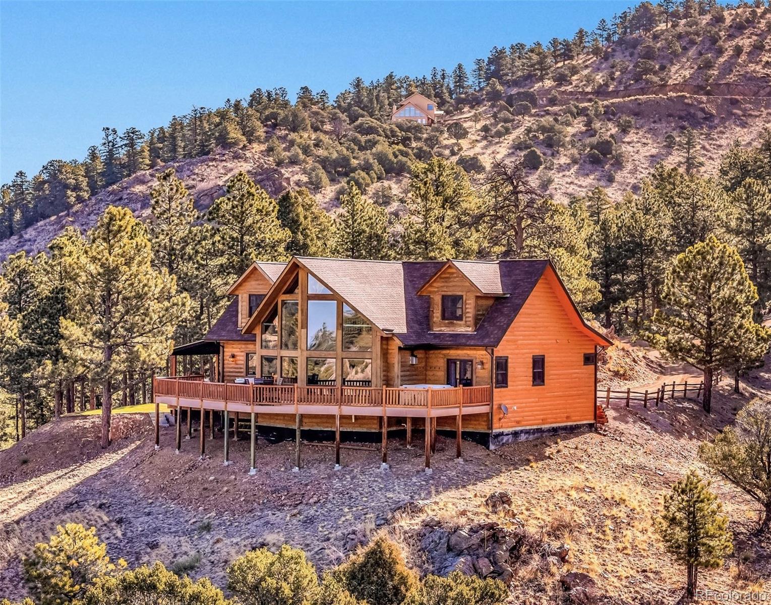 400 Ridge Road Westcliffe, CO 81252 - Photo 34 of 37 a view of a house with wooden fence