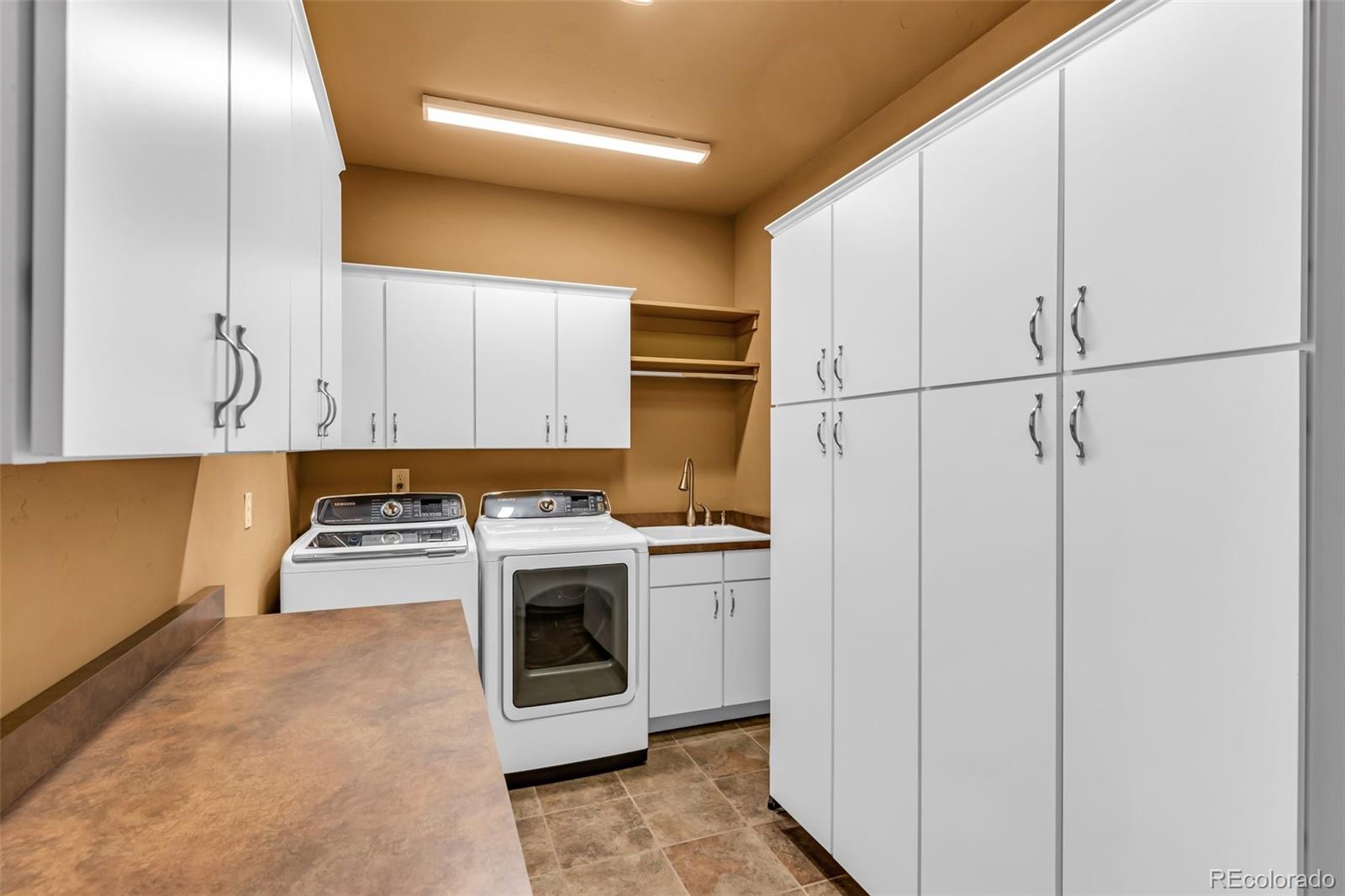 400 Ridge Road Westcliffe, CO 81252 - Photo 37 of 37 a kitchen with cabinets and white stainless steel appliances