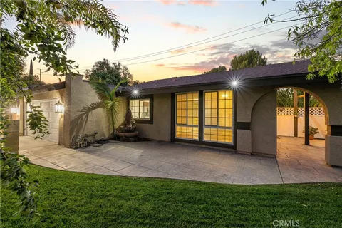a view of backyard with a barn and a cactus plant