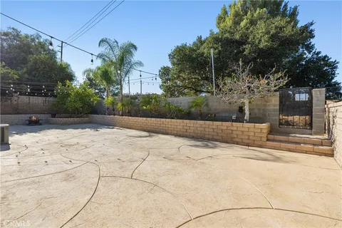 a view of a backyard with sitting area