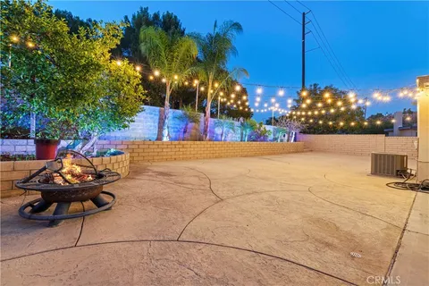 a view of street with potted plants