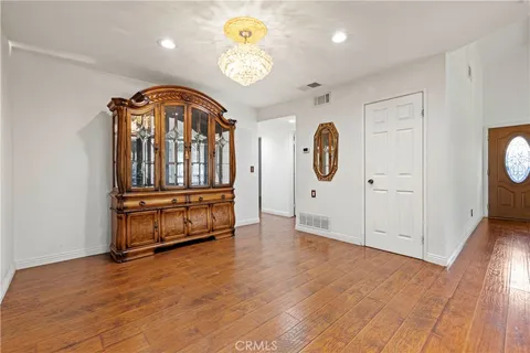a view of an entryway with wooden floor