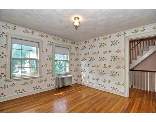 58 Ravine Road Medford, MA 02155 - Photo 9 of 13 a view of an empty room with wooden floor and a window