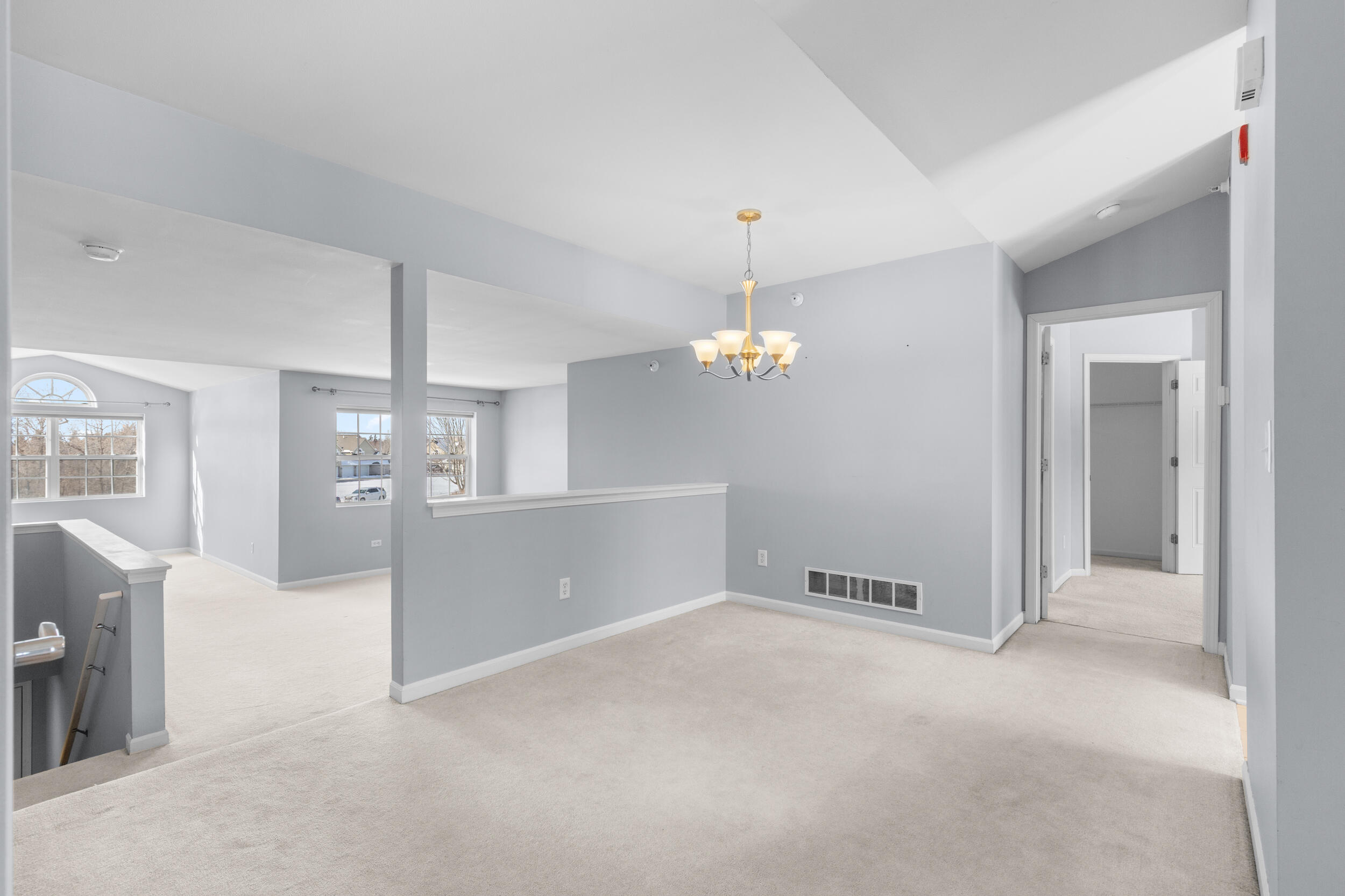 9155 West Elm Court, Unit E Franklin, WI 53132 - Photo 9 of 33 Step up from the Entryway into the rest of the living space