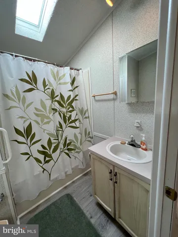 a view of a room with table and chairs