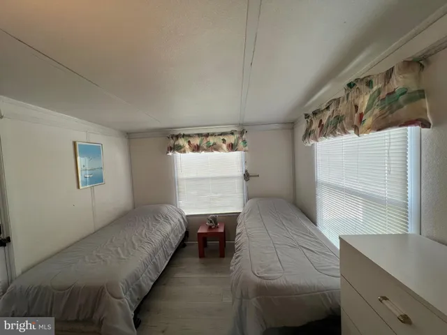 a view of a house with backyard sitting area and garden