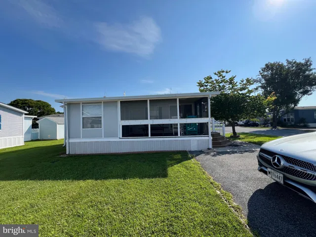 a bathroom with a sink a mirror and a shower