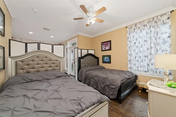 a bedroom with double bed and a window