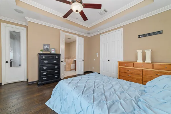 a bedroom with a bed and a dresser