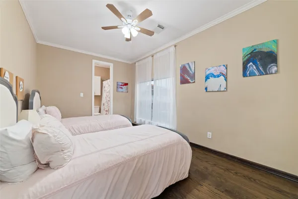 a bedroom with a bed and a walk in closet