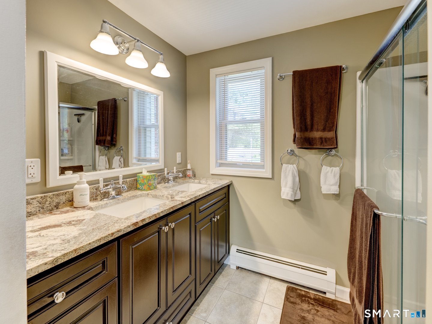 97 Lair Road New Hartford, CT 06057 - Photo 27 of 39 a bathroom with a granite countertop sink a mirror and a shower