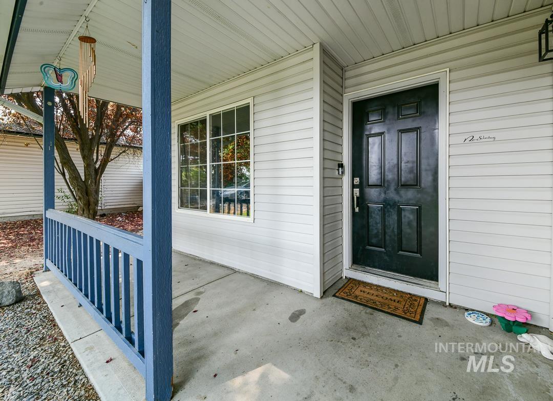 805 Bison Way Caldwell, ID 83607 - Photo 7 of 45 Covered front porch with concrete flooring and light-colored siding