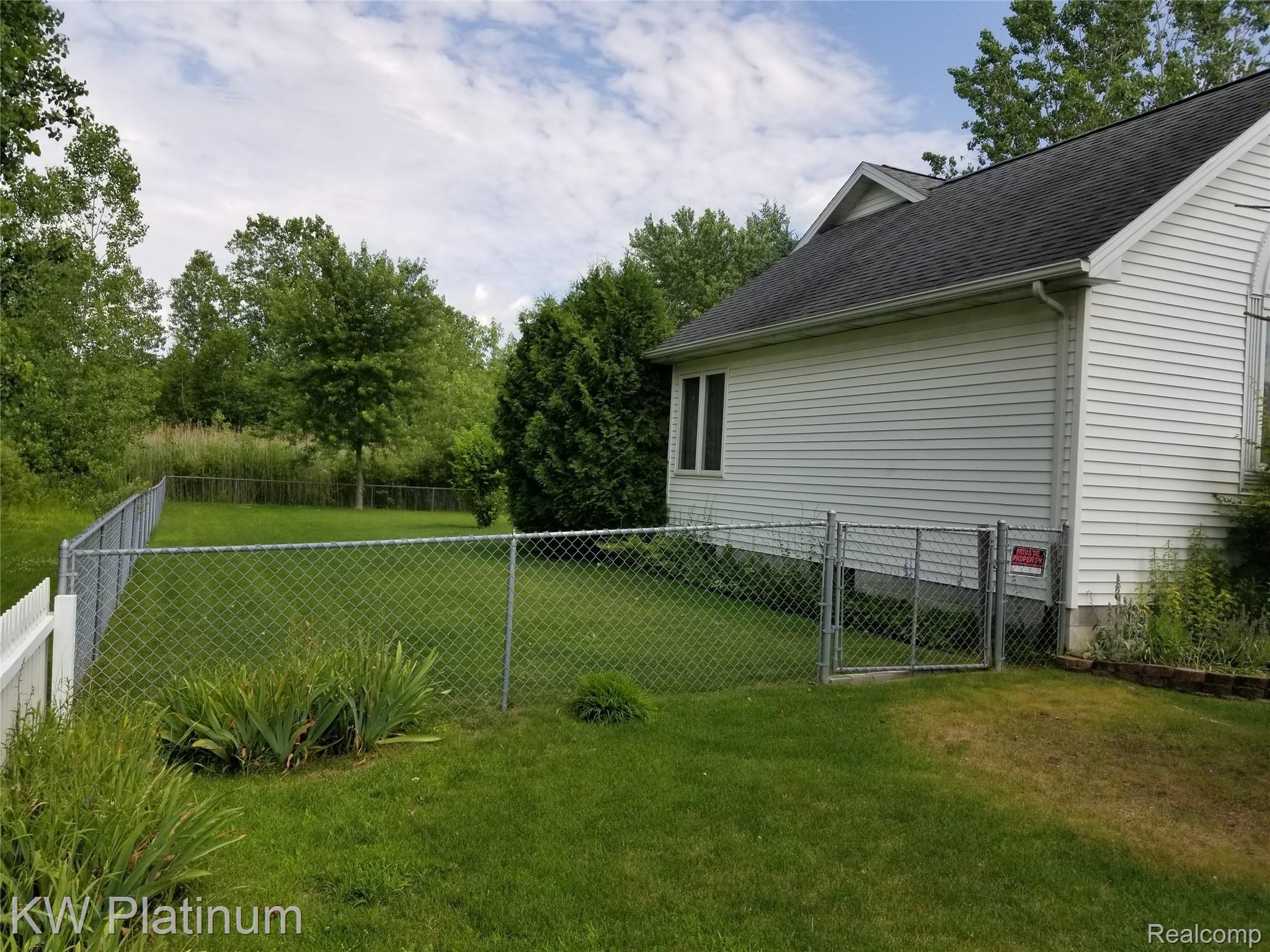 1310 Allen Road Smiths Creek, MI 48074 - Photo 4 of 27 NORTH SIDE VIEW. FENCED YARD.