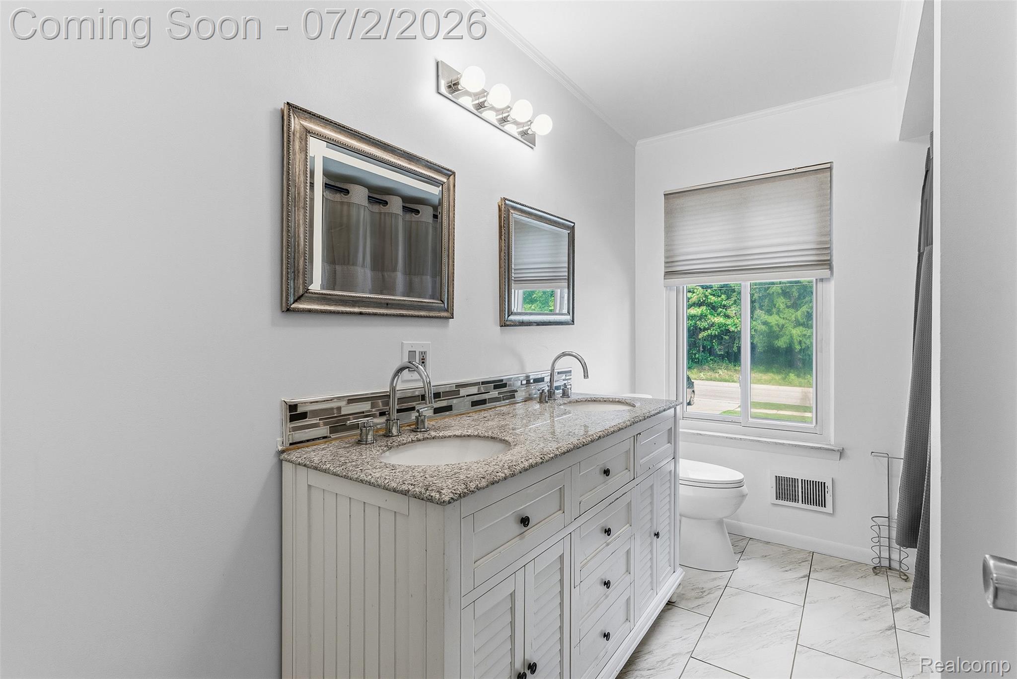 305 East Road Holly, MI 48442 - Photo 17 of 41 Dual vanity with a stone countertop and integrated sinks