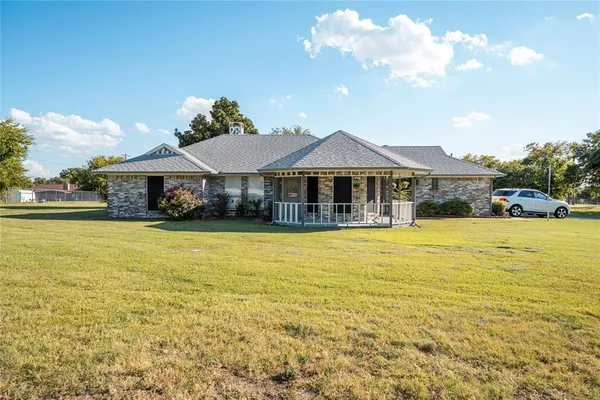 a front view of a house with a swimming pool