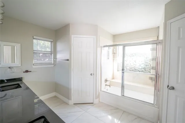 a view of a room that has a bed in it