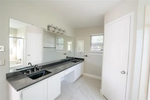 a kitchen with a sink and cabinets