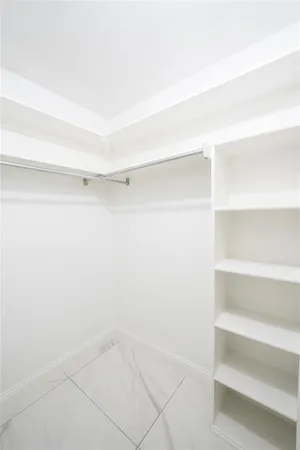 a view of an empty walk in closet