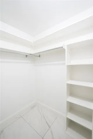 a view of an empty walk in closet
