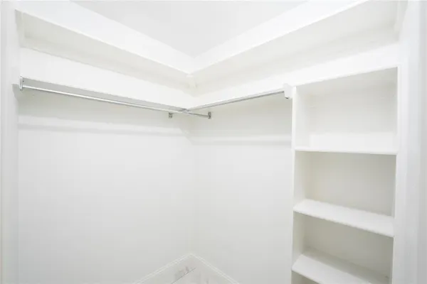 a view of an empty walk in closet