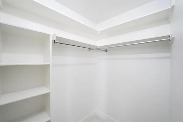 a view of an empty walk in closet