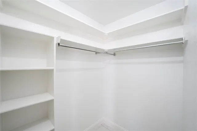 a view of an empty walk in closet