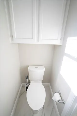 a bathroom with a toilet