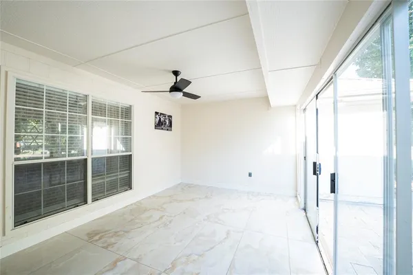 a view of empty room with windows