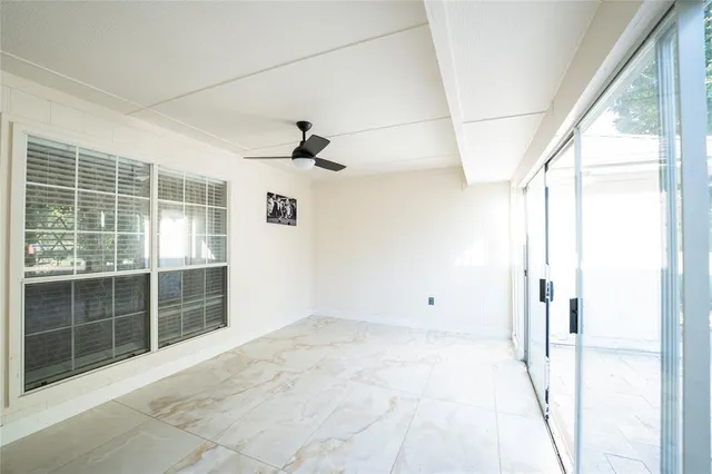 a view of empty room with windows