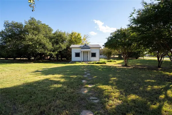 a view of house with swimming pool