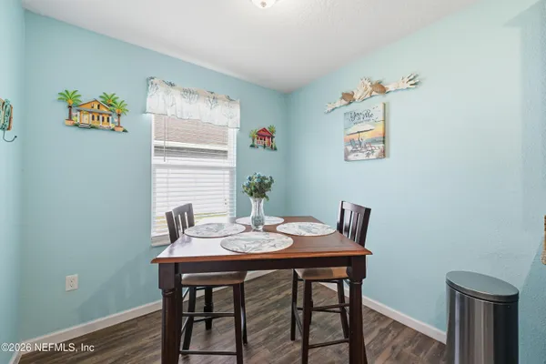 a view of a dining room with furniture