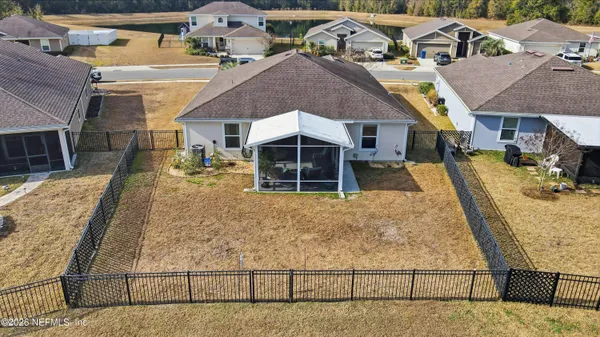 an aerial view of a house with swimming pool