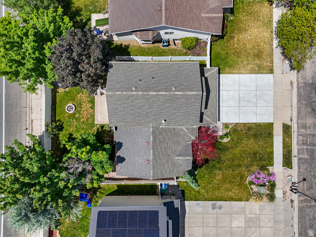 142 East 2675th Street South Clearfield, UT 84015 - Photo 40 of 49 Aerial overview showcasing a property with a gray shingle roof, a concrete driveway, and established landscaping