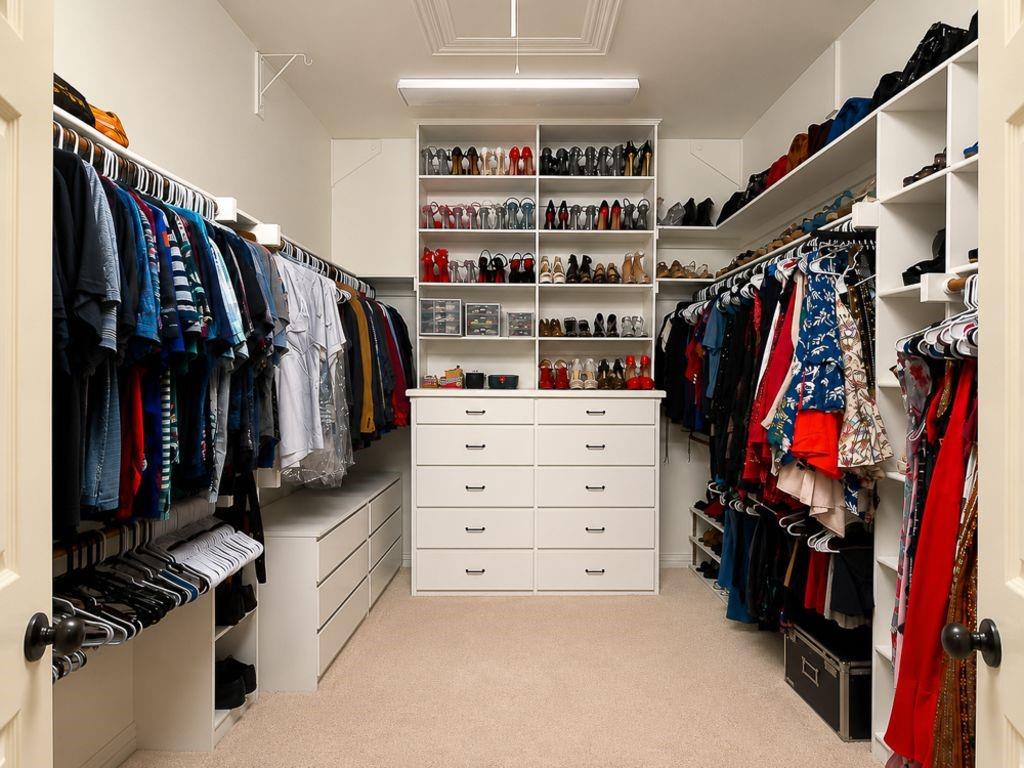 7005 Peter's Path Colleyville, TX 76034 - Photo 26 of 40 a view of walk in closet with clothes and shoes