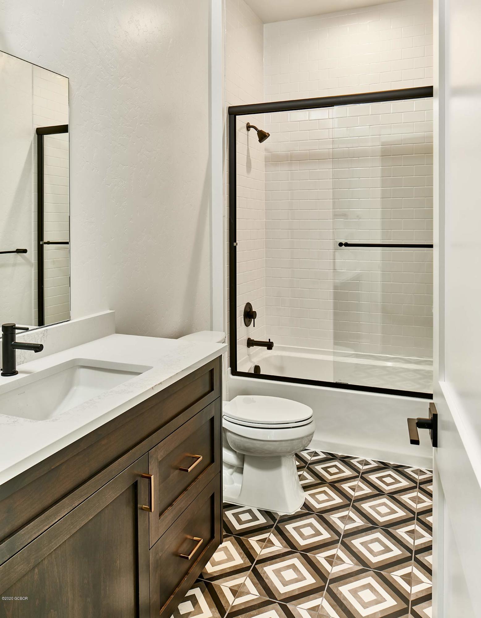 108 Rendezvous Way Winter Park, CO 80482 - Photo 2 of 16 a bathroom with a sink toilet and shower