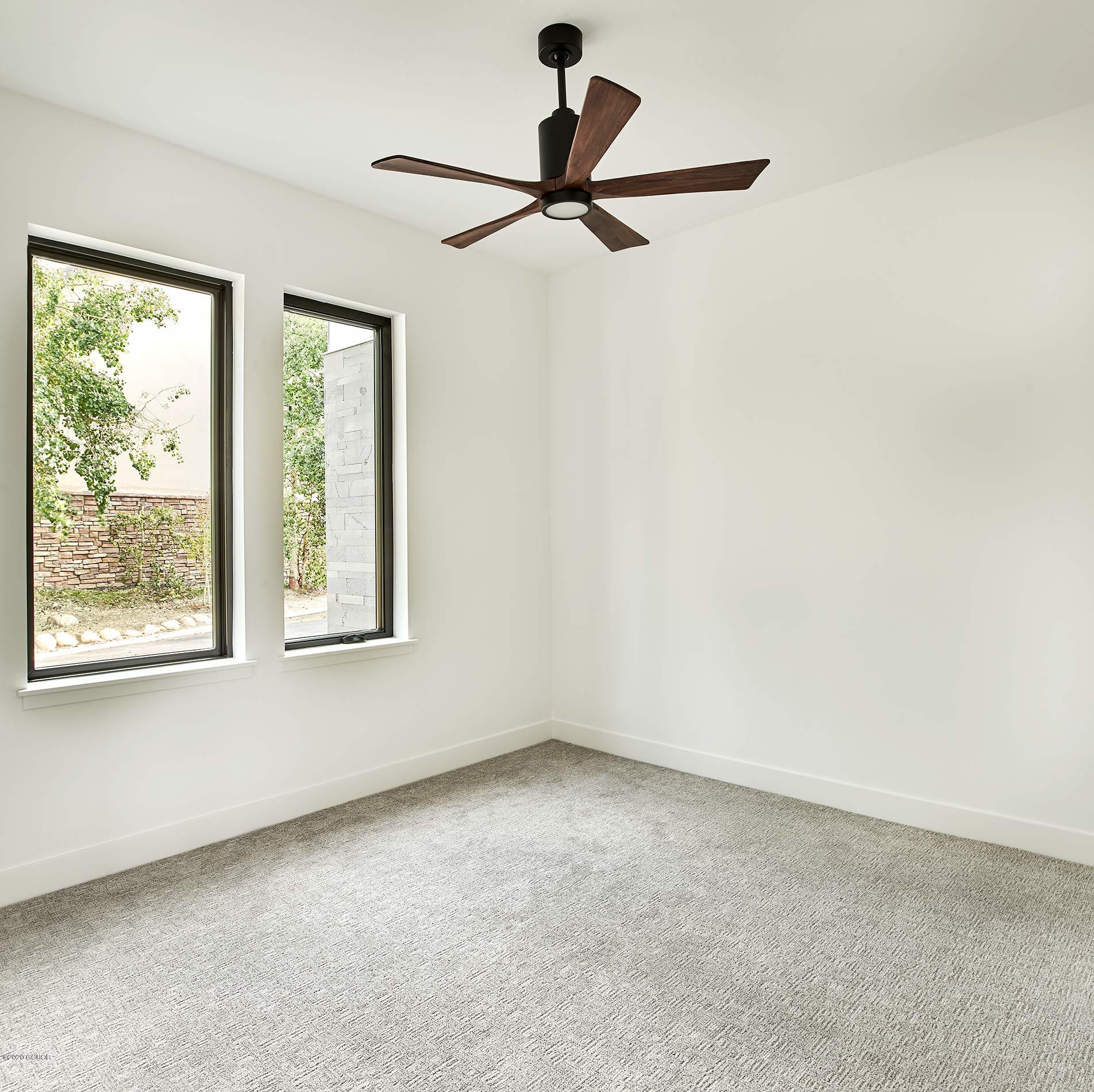 108 Rendezvous Way Winter Park, CO 80482 - Photo 3 of 16 a view of a livingroom with a ceiling fan and window