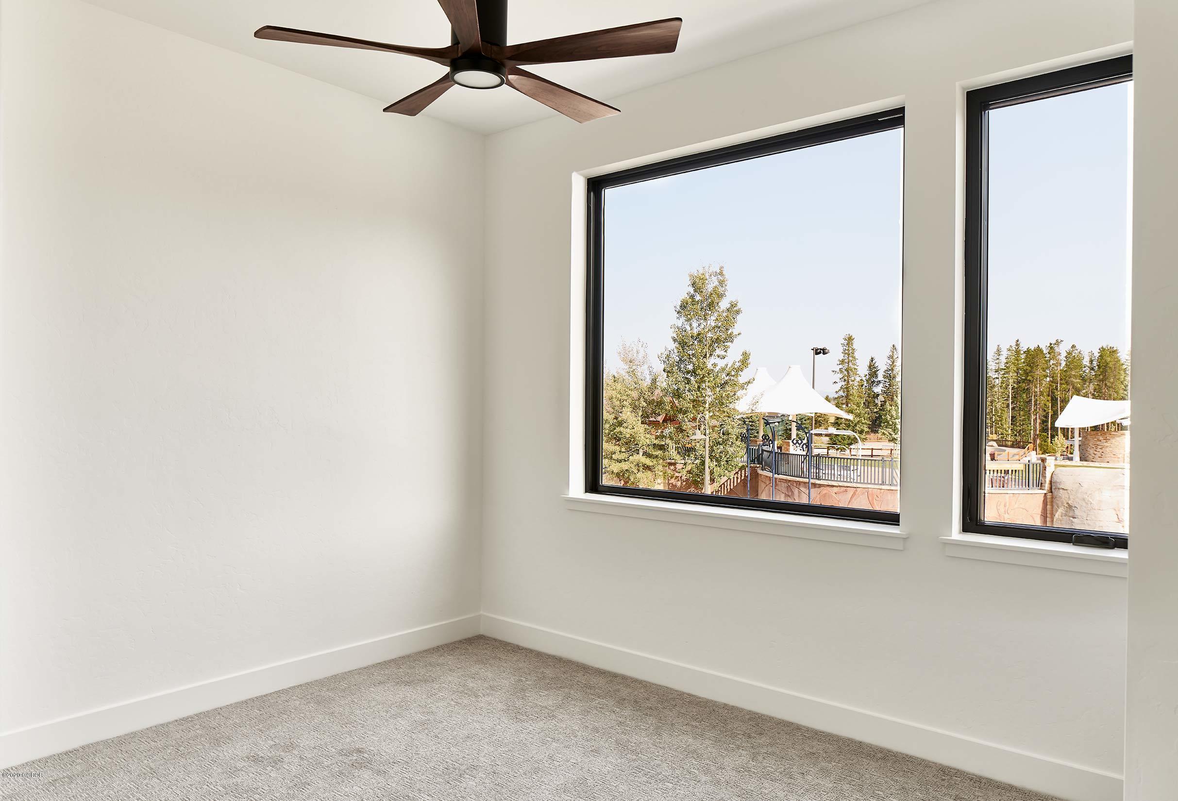 108 Rendezvous Way Winter Park, CO 80482 - Photo 5 of 16 an empty room with a large window