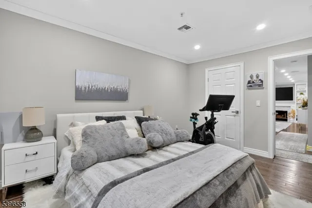 a bed room with furniture and a flat screen tv