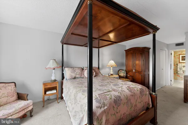 a bed room with a bed and a painting