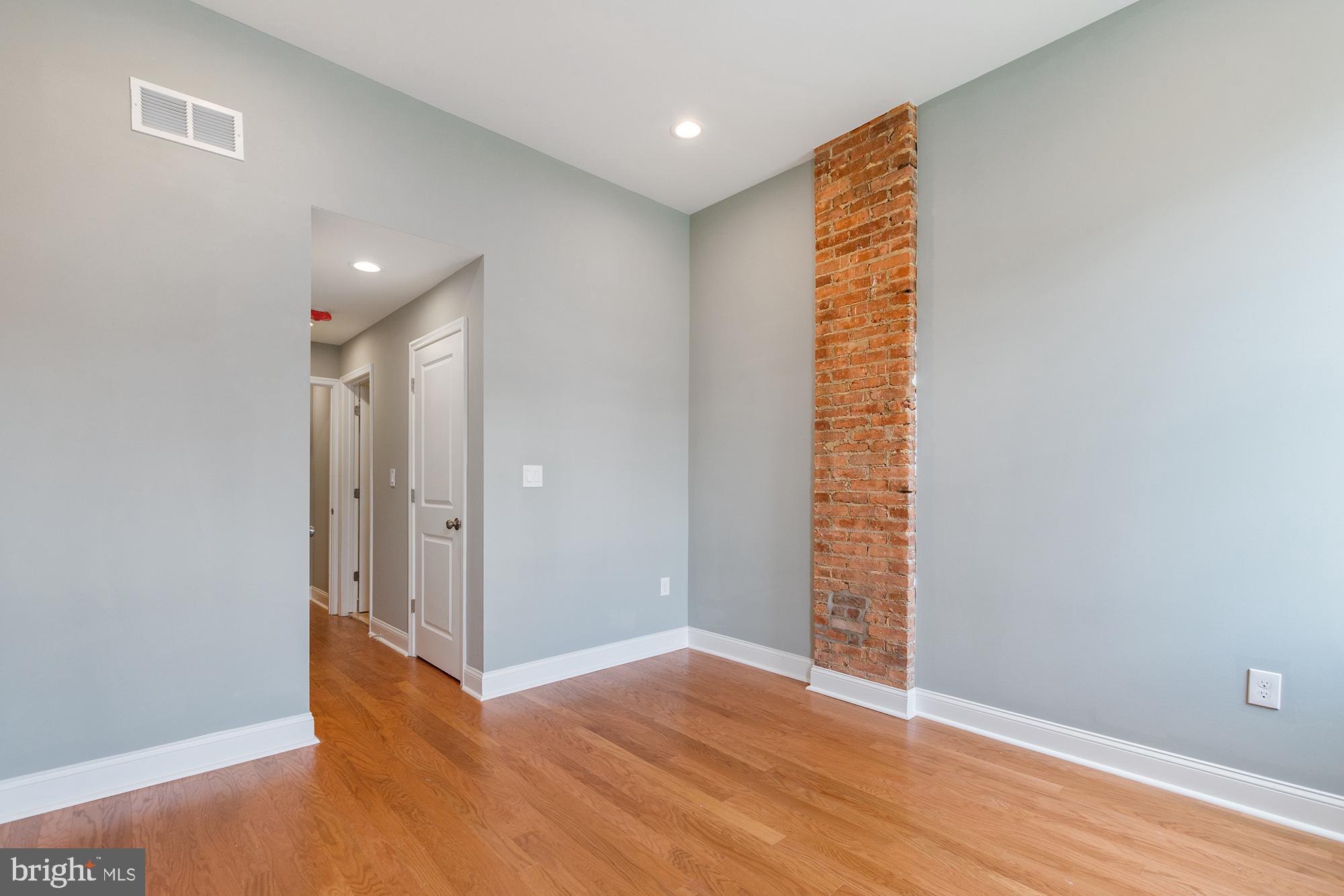 1433 Federal Street Baltimore, MD 21213 - Photo 7 of 9 a view of entryway with wooden floor