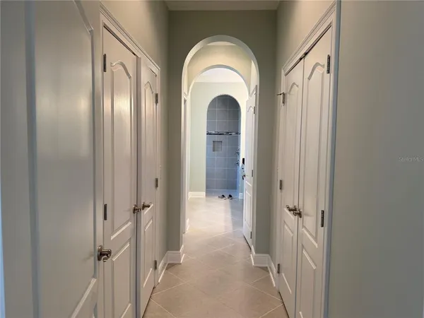 a bathroom with a granite countertop sink a mirror and shower