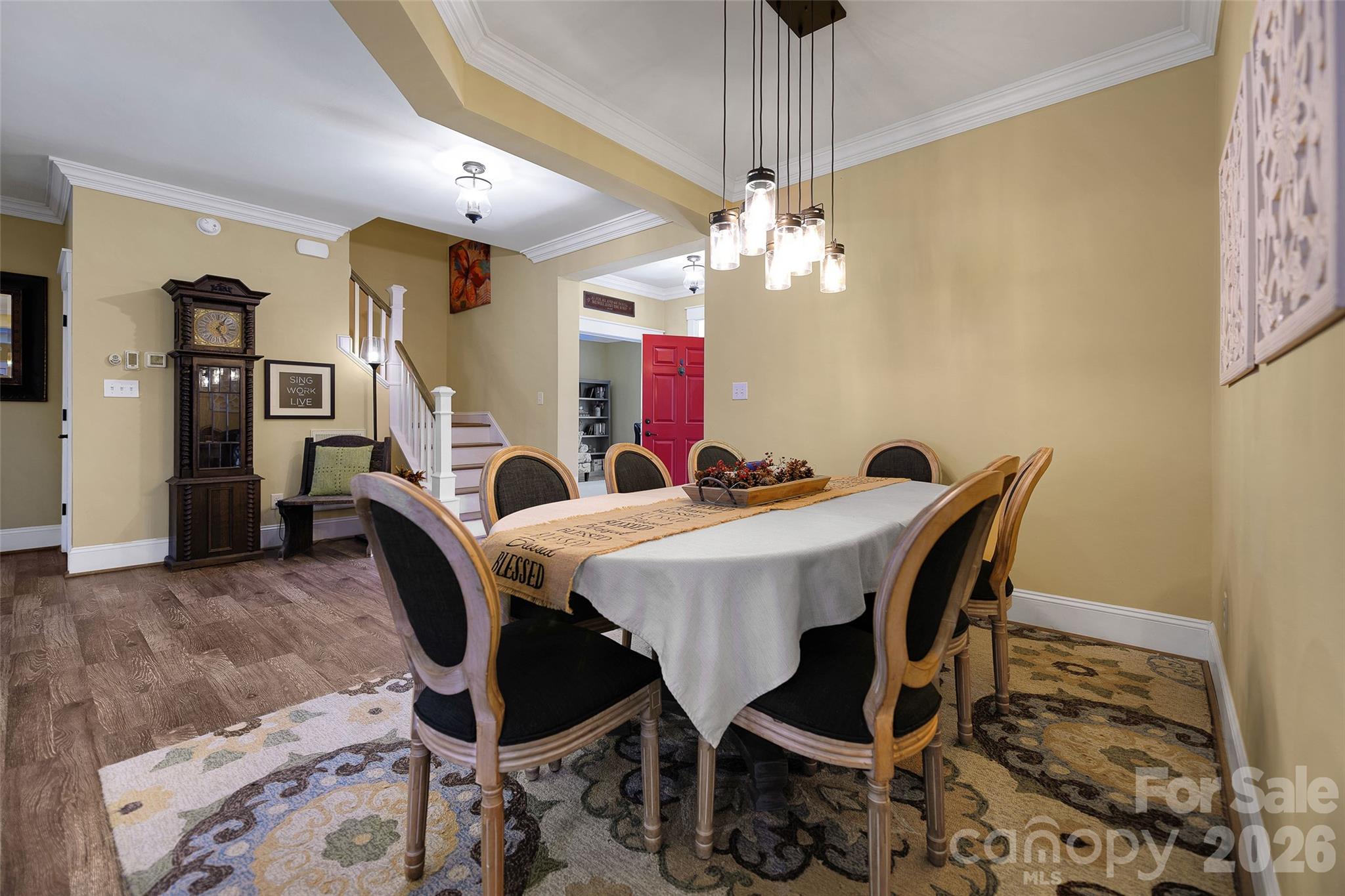 211 Holly Ridge Road Dallas, NC 28034 - Photo 13 of 46 a view of a dining room with furniture and chandelier
