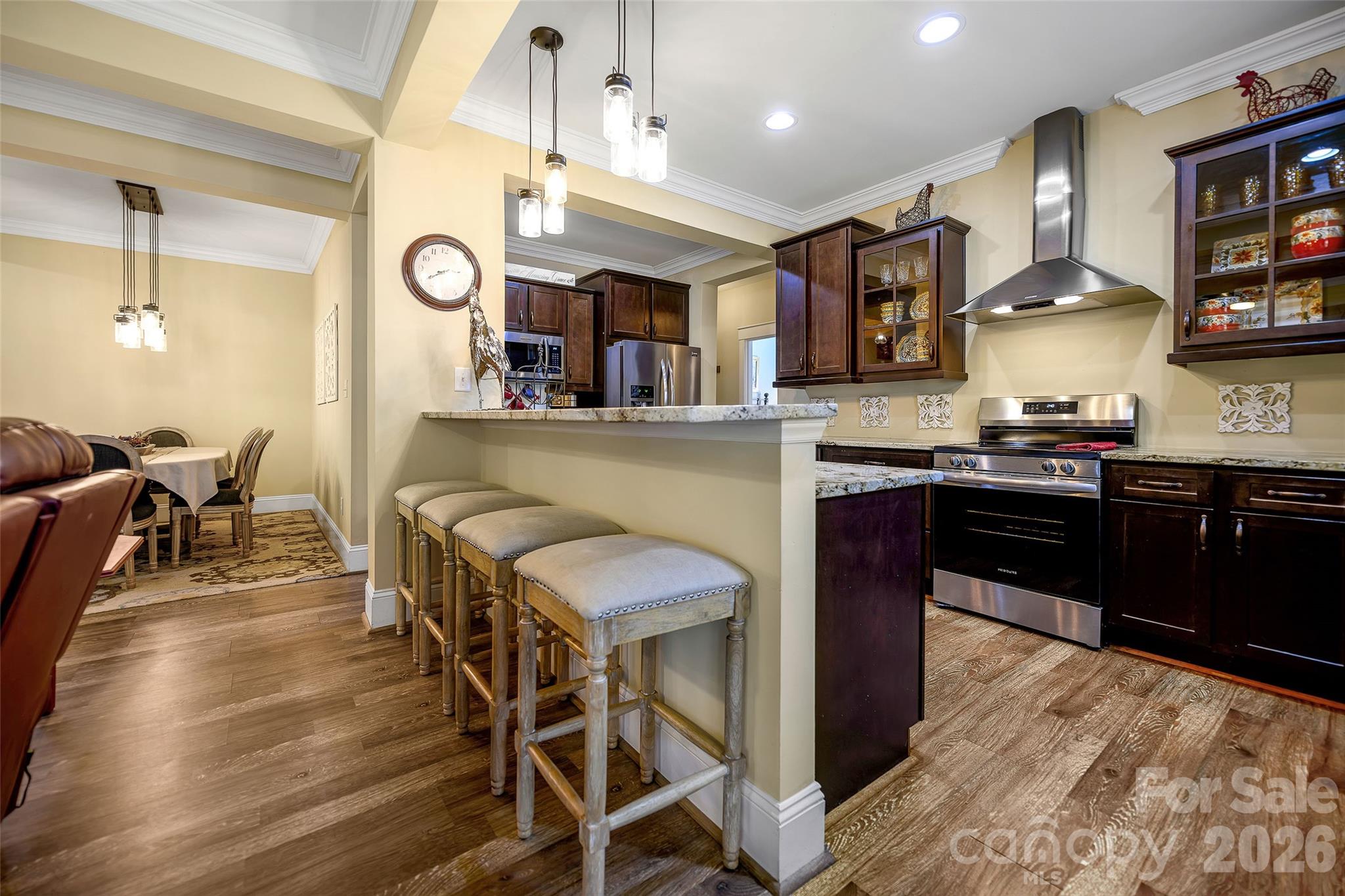 211 Holly Ridge Road Dallas, NC 28034 - Photo 17 of 46 a kitchen with a table and chairs in it