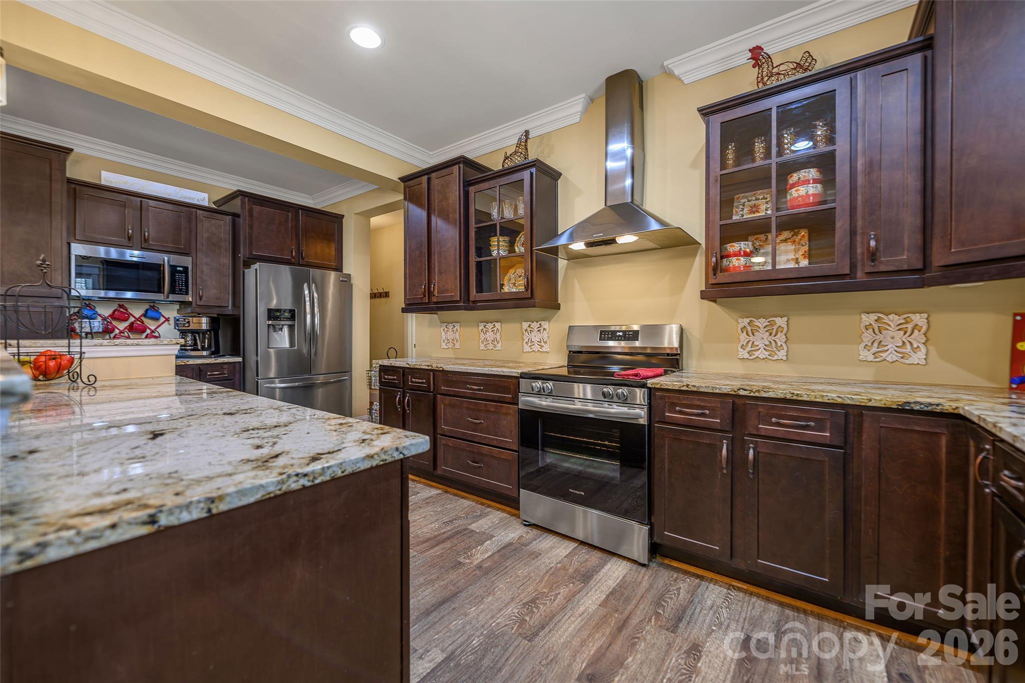 211 Holly Ridge Road Dallas, NC 28034 - Photo 18 of 46 a kitchen with stainless steel appliances granite countertop a stove and a refrigerator