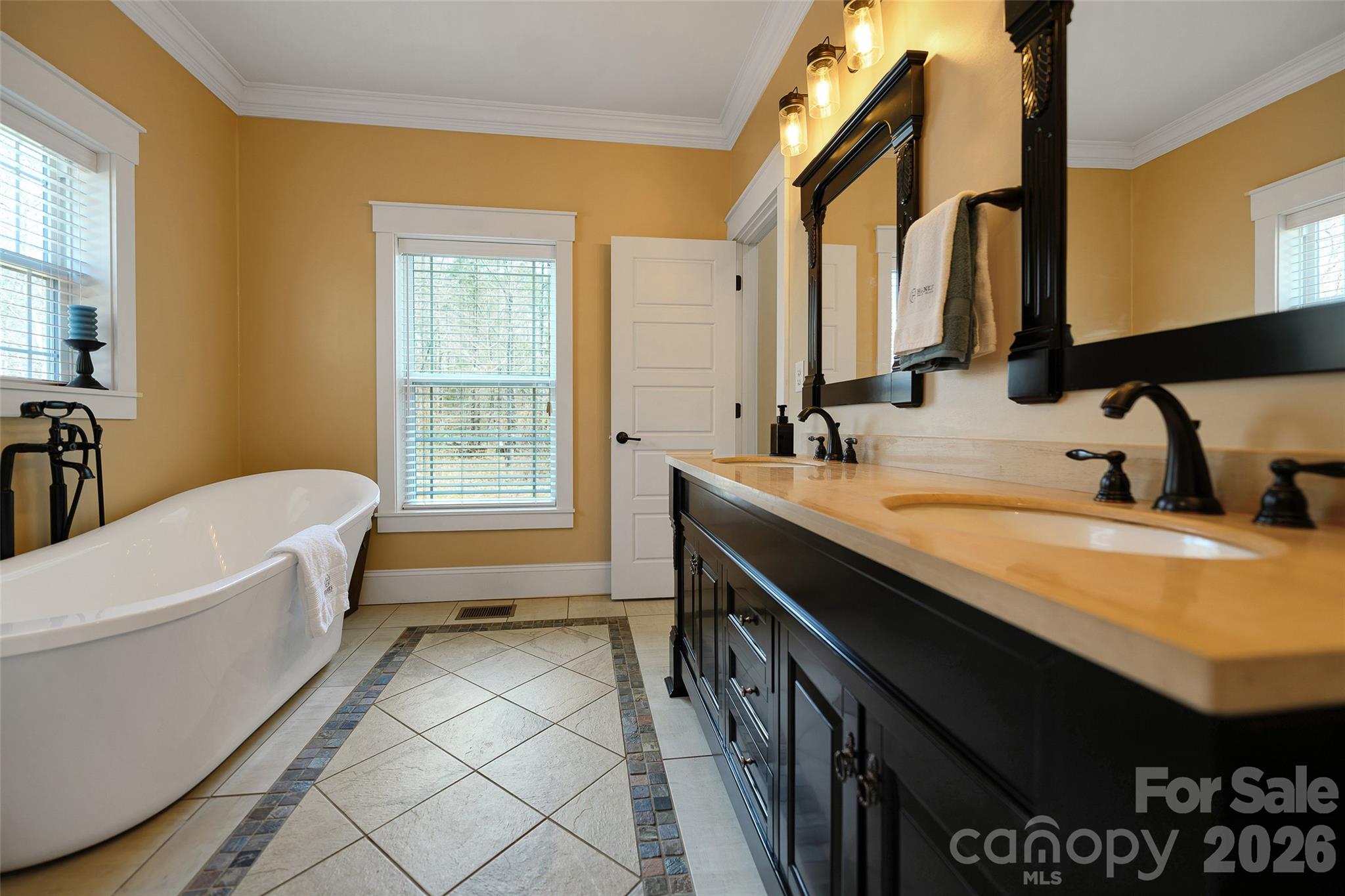 211 Holly Ridge Road Dallas, NC 28034 - Photo 24 of 46 a bathroom with a tub sink and mirror