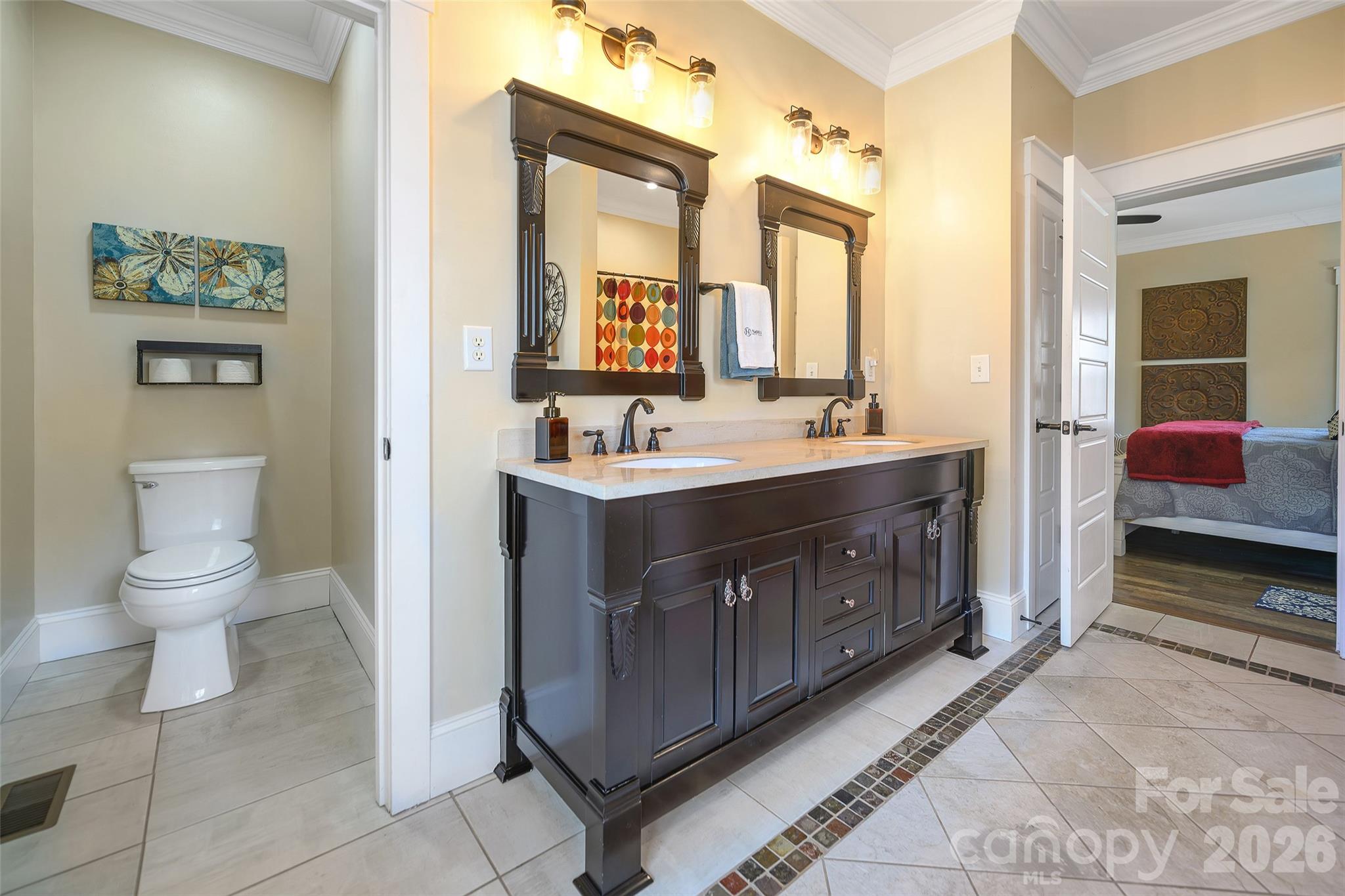 211 Holly Ridge Road Dallas, NC 28034 - Photo 25 of 46 a bathroom with a double vanity sink a toilet and a mirror