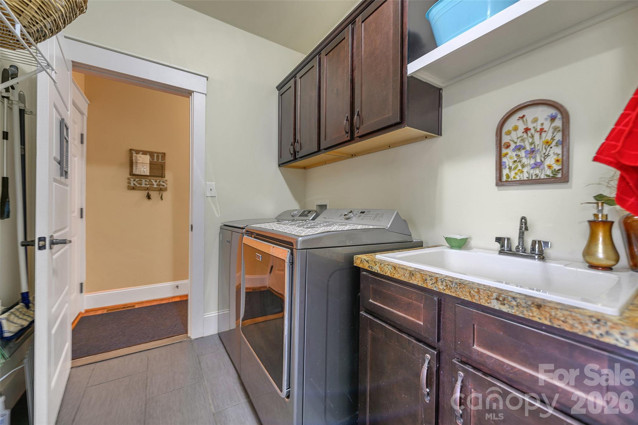 211 Holly Ridge Road Dallas, NC 28034 - Photo 30 of 46 a utility room with sink dryer and washer